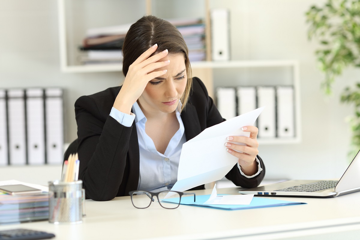 Seated Person Opens Mail/Bills