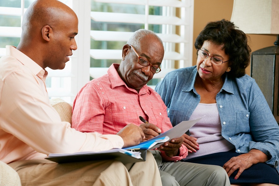 Older Couple Getting Help on Their Taxes|Woman Filling Out Her Taxes