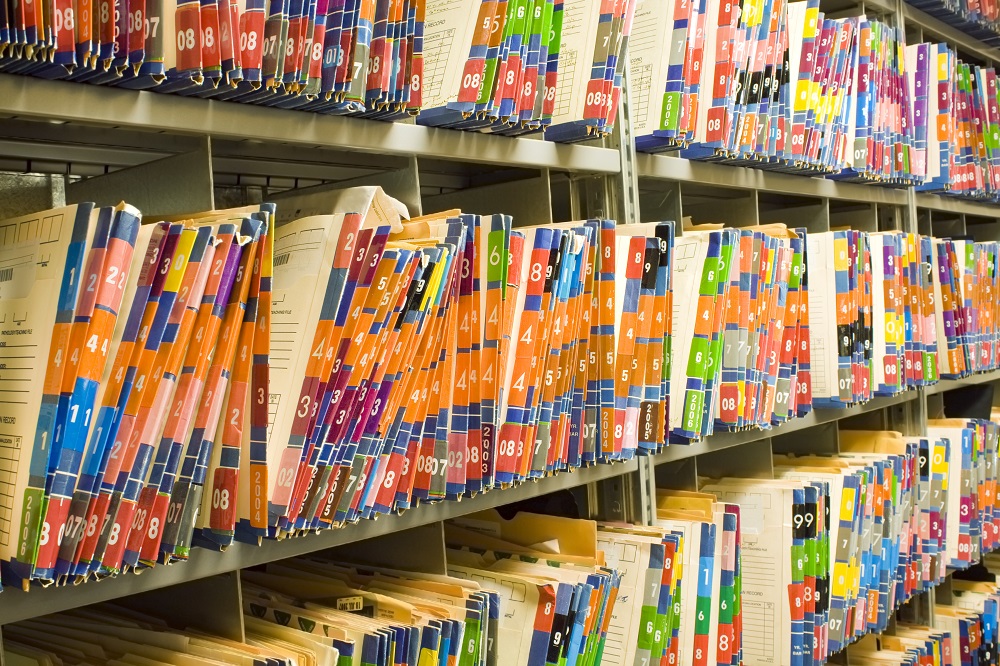 Medical records filling shelves