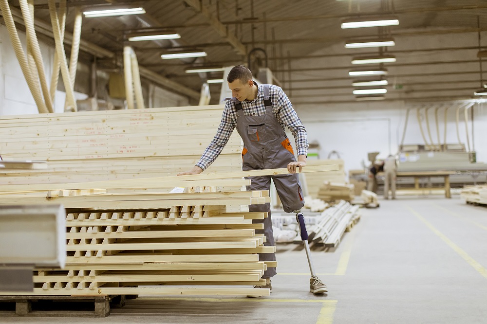 Worker with prosthetic leg