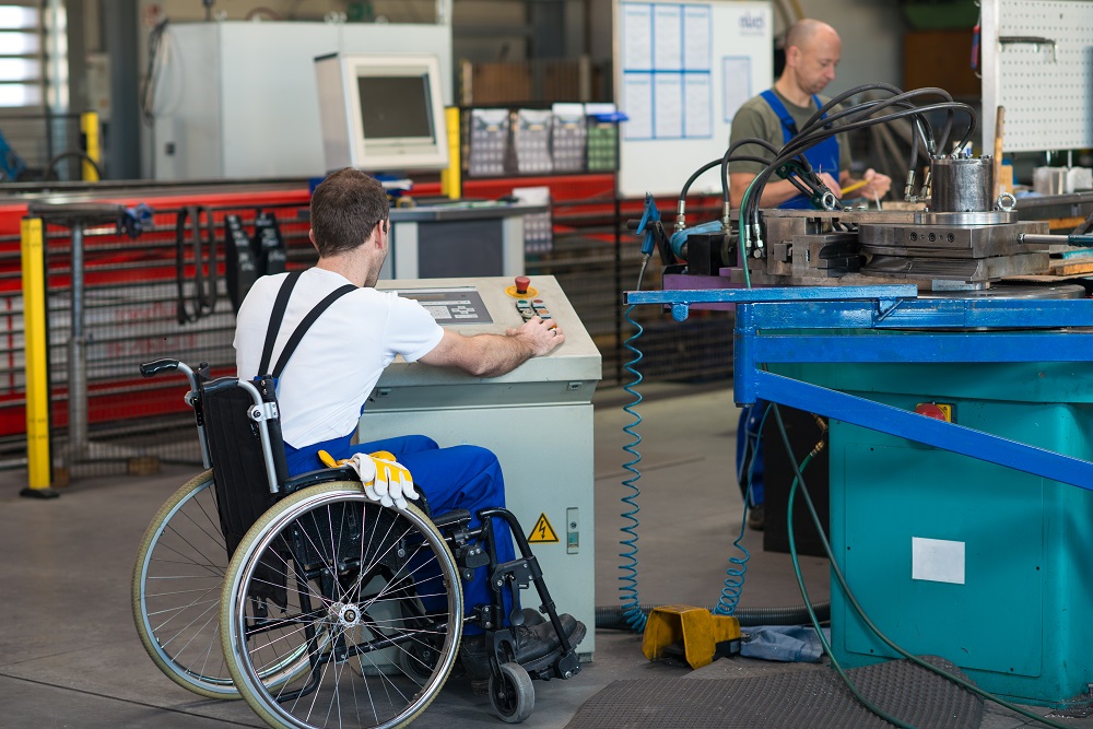 Disabled Worker in Wheelchair Working in Factory